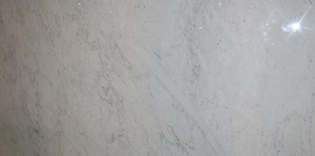 A white marble surface with some gray streaks.