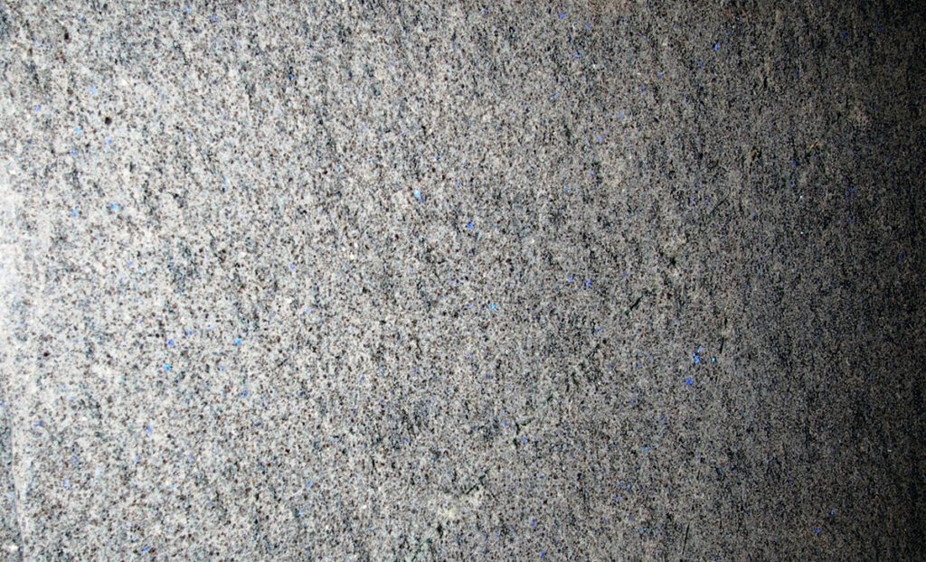 A close up of the fabric surface of a carpet.