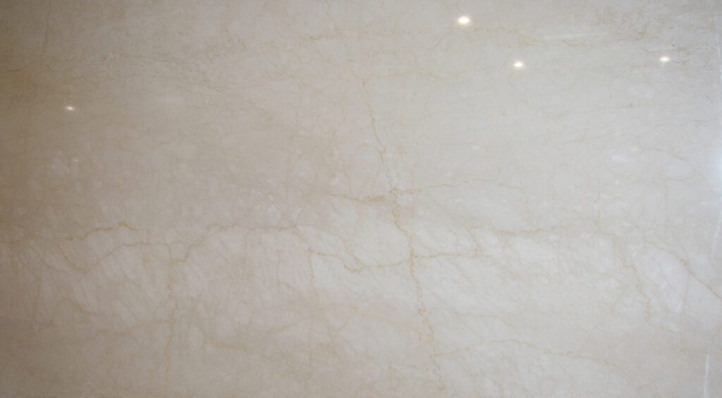 A white marble surface with some light spots
