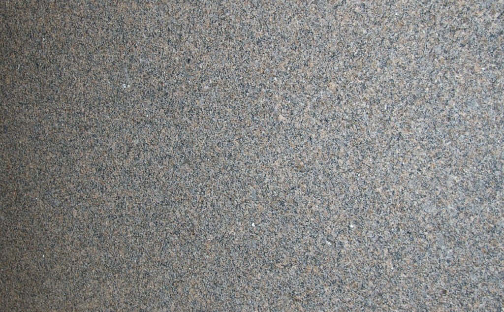 A close up of the surface of a stone floor.
