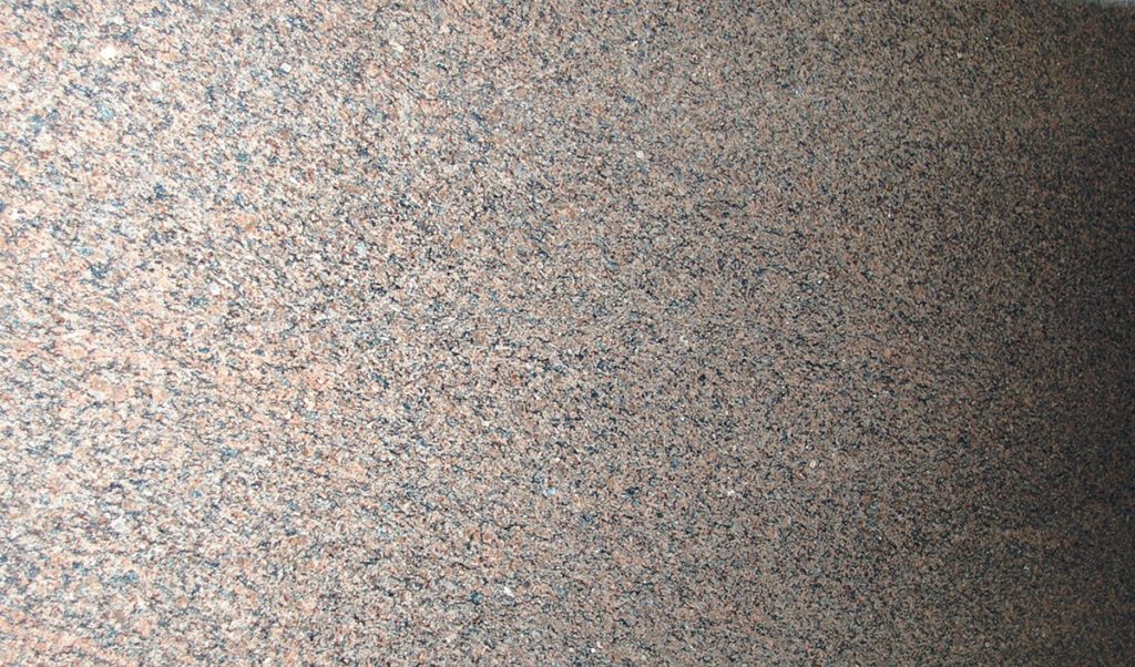 A close up of the granite surface of a building