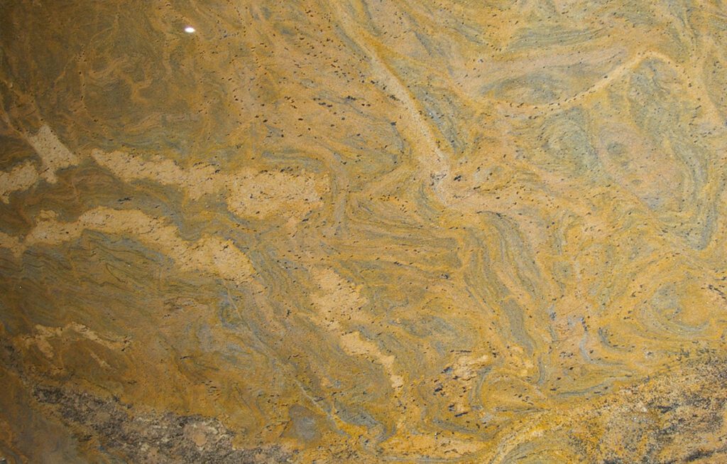A close up of the yellow and brown marble