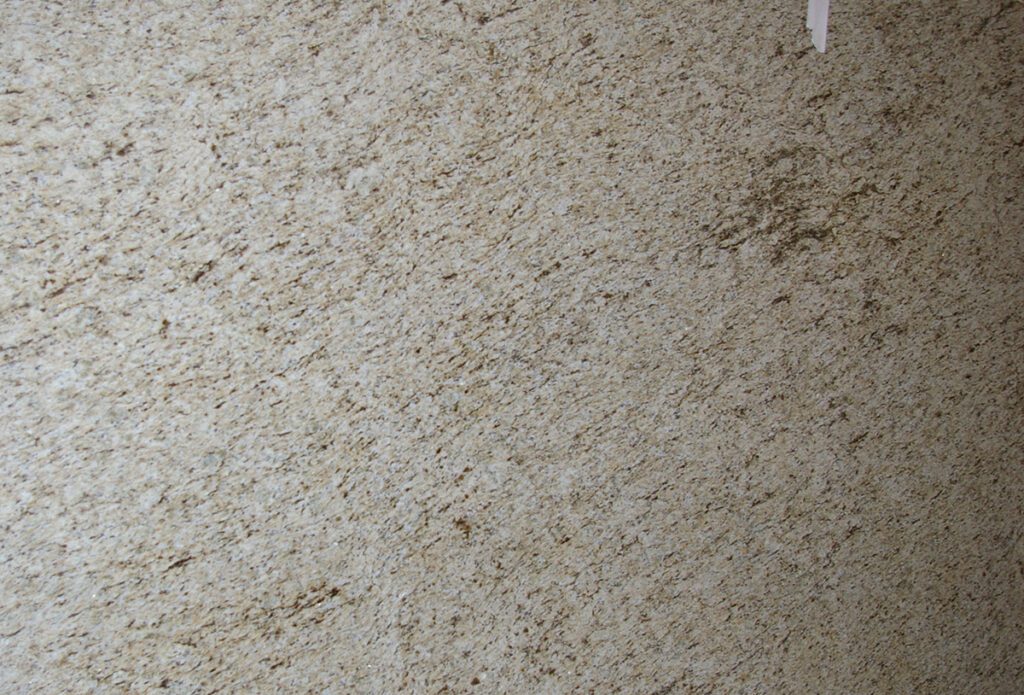 A close up of the floor with white carpet.