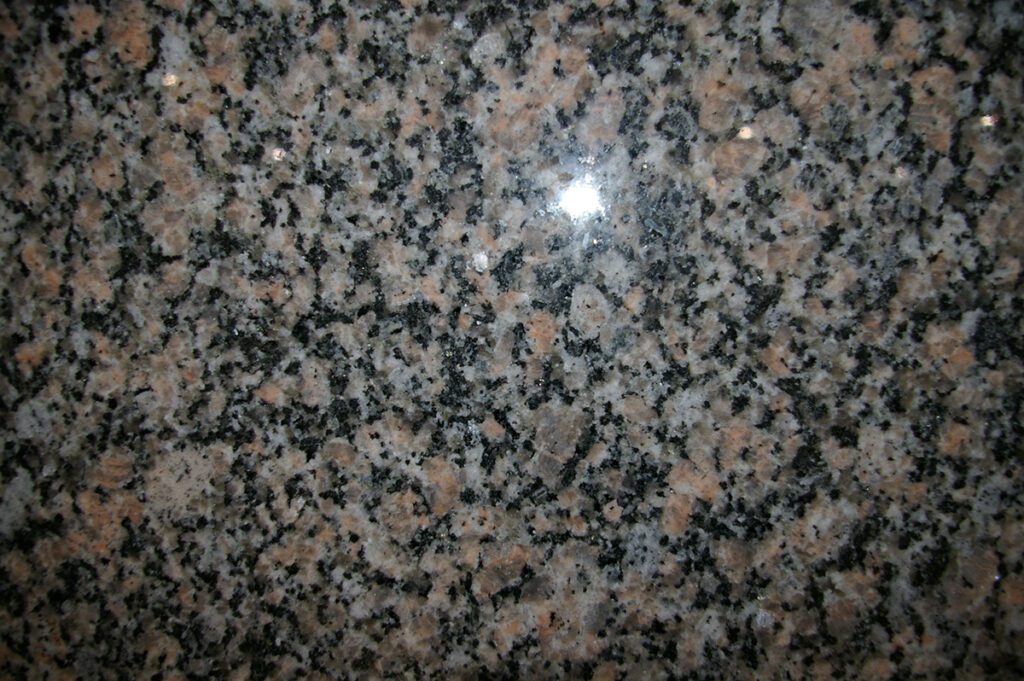 A close up of the granite surface of a counter.
