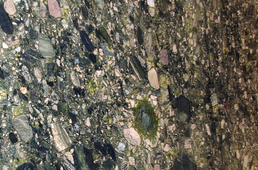 A close up of rocks and minerals in the water.