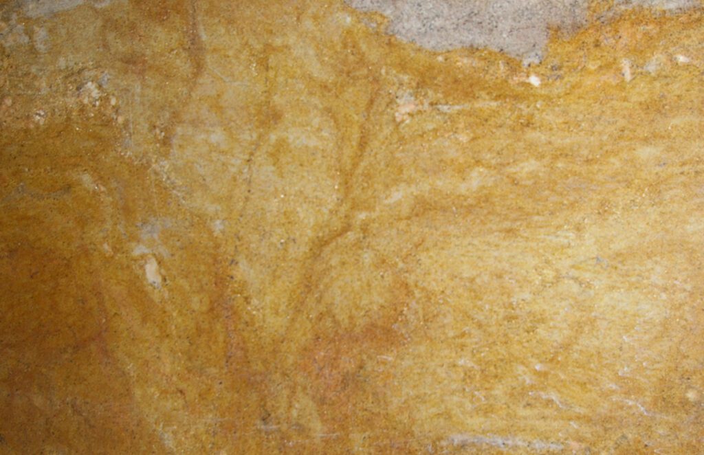 A close up of the yellow marble surface