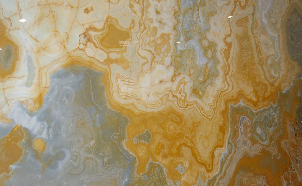 A close up of the yellow and gray marble
