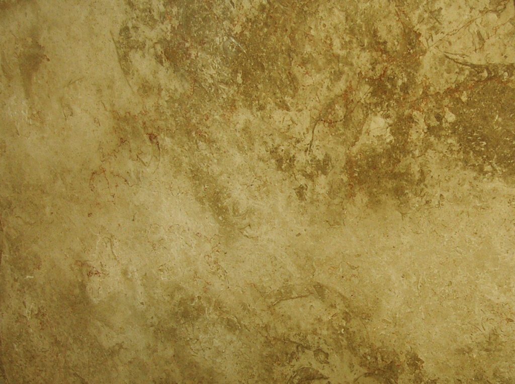 A brown and tan background with some white spots