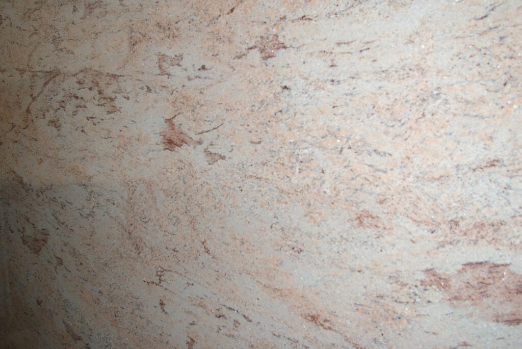 A close up of the surface of a marble wall.