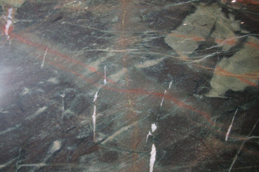 A close up of the marble floor with red lines