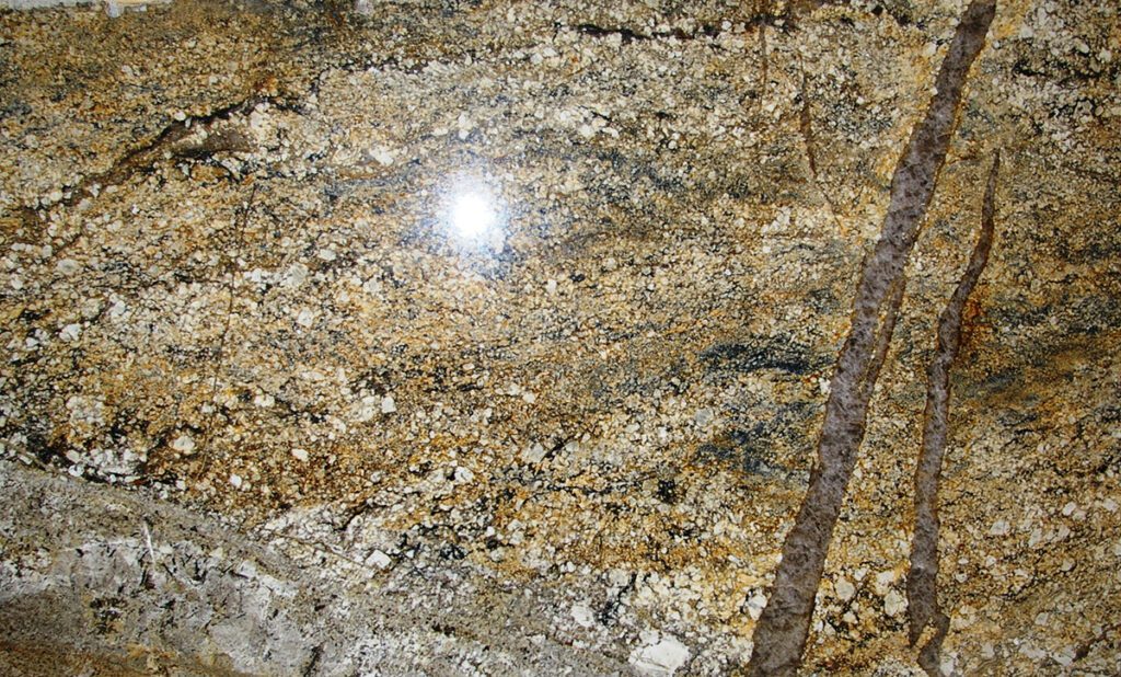 A close up of the sun shining on the surface of a stone.