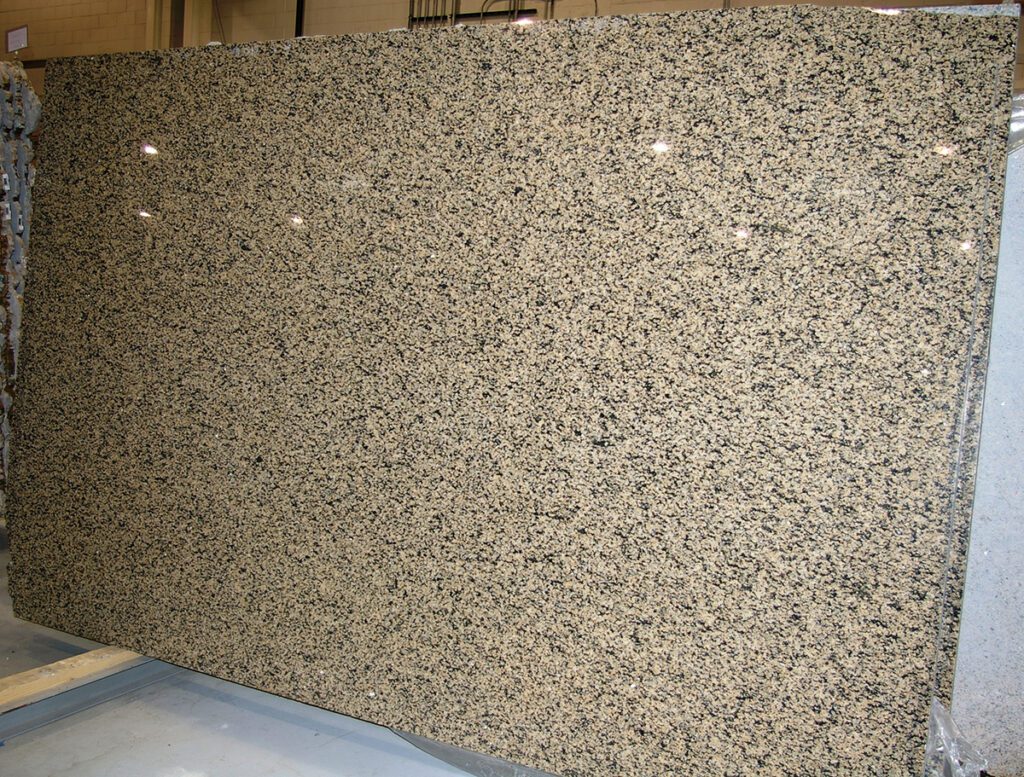 A granite slab with some white spots on it